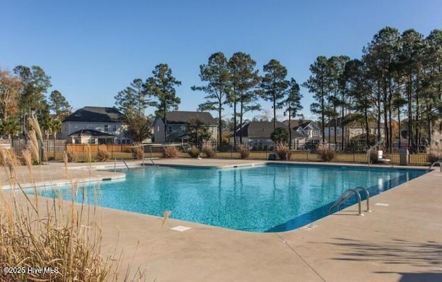 5920 Appomattox Dr, Wilmington, NC 28409 - community pool featuring a patio and a residential view