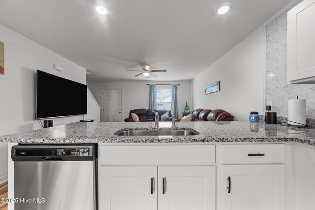 3402 Woodwind Ct, Kinston, NC 28504 - kitchen featuring stainless steel dishwasher, open floor plan, light stone counters, white cabinets, and recessed lighting