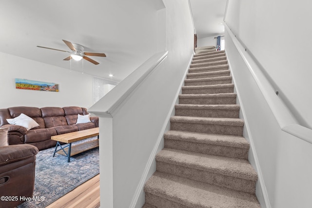 3402 Woodwind Ct, Kinston, NC 28504 - stairs with ceiling fan, wood finished floors, and baseboards