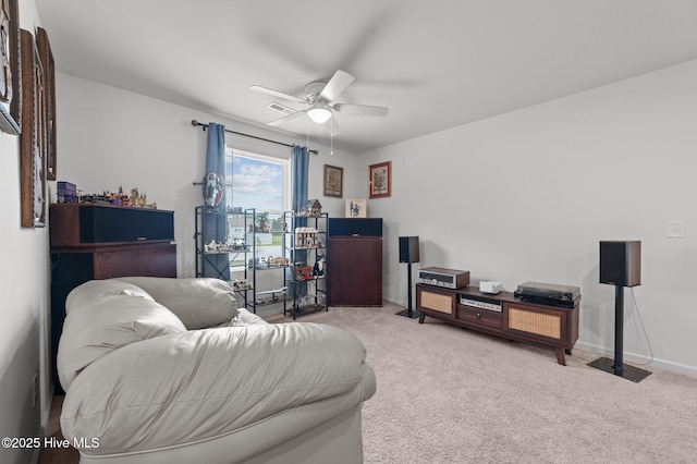 3402 Woodwind Ct, Kinston, NC 28504 - carpeted living room featuring a ceiling fan and baseboards