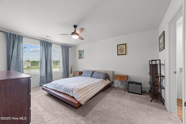 3402 Woodwind Ct, Kinston, NC 28504 - bedroom with light carpet, ceiling fan, and baseboards