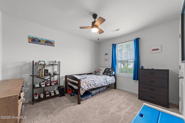 3402 Woodwind Ct, Kinston, NC 28504 - carpeted bedroom with baseboards and a ceiling fan