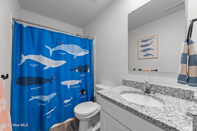 3402 Woodwind Ct, Kinston, NC 28504 - full bathroom featuring toilet, vanity, wood finished floors, and a shower with curtain