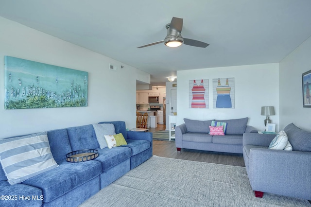 1896 New River Inlet Rd Unit 1212, North Topsail Beach, NC 28460 - living area featuring wood finished floors and ceiling fan