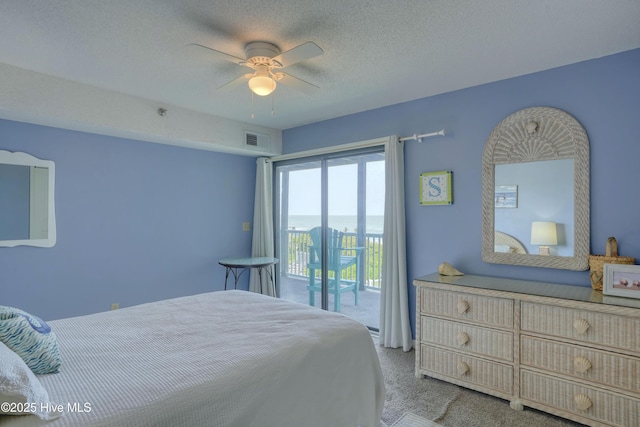 1896 New River Inlet Rd Unit 1212, North Topsail Beach, NC 28460 - carpeted bedroom with access to exterior and ceiling fan