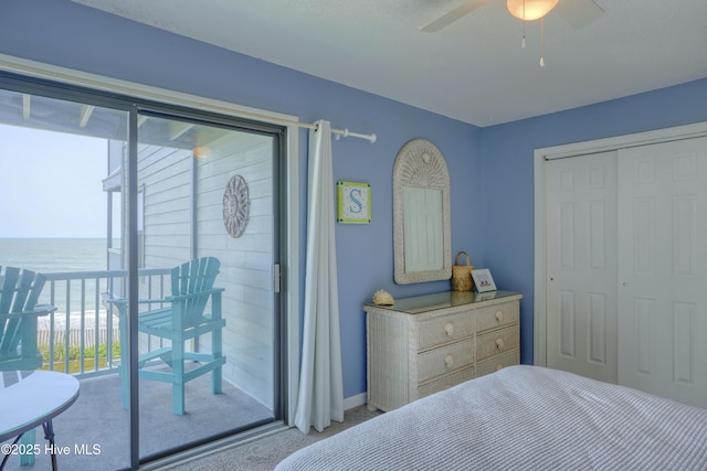 1896 New River Inlet Rd Unit 1212, North Topsail Beach, NC 28460 - bedroom featuring carpet floors, a water view, access to exterior, and a closet