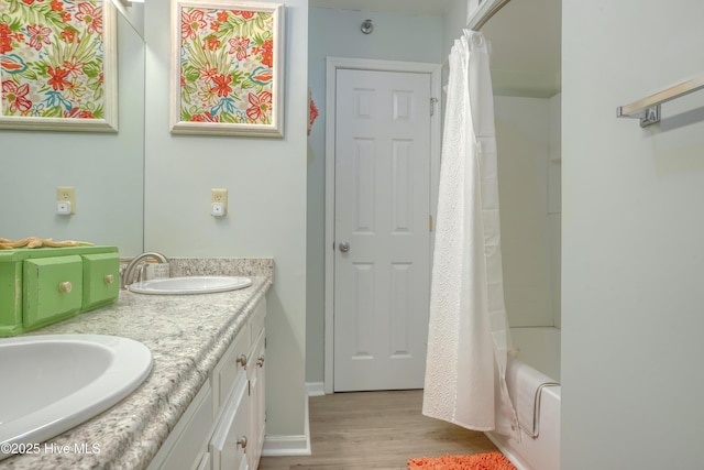 1896 New River Inlet Rd Unit 1212, North Topsail Beach, NC 28460 - full bath featuring wood finished floors, double vanity, and shower / tub combo with curtain