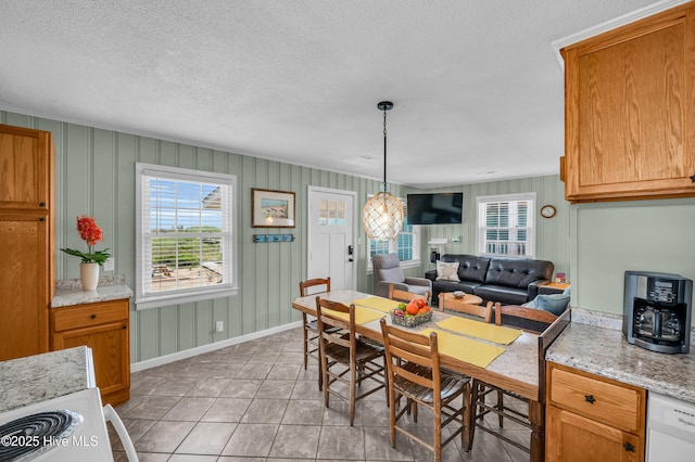 1020 Carolina Beach Ave N, Carolina Beach, NC 28428 - dining room with a textured ceiling and light tile patterned floors