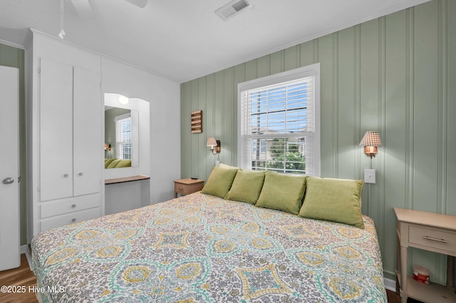 1020 Carolina Beach Ave N, Carolina Beach, NC 28428 - bedroom featuring wood finished floors and ornamental molding