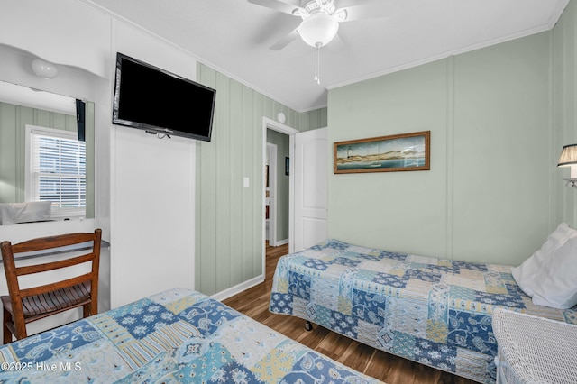1020 Carolina Beach Ave N, Carolina Beach, NC 28428 - bedroom with ornamental molding, wood finished floors, and ceiling fan