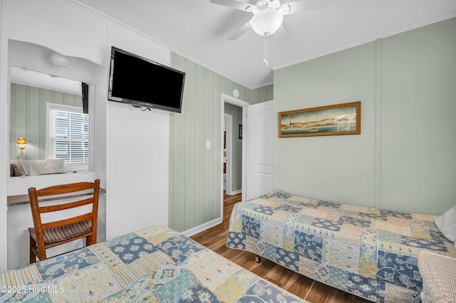 1020 Carolina Beach Ave N, Carolina Beach, NC 28428 - bedroom featuring crown molding, wood finished floors, and a ceiling fan