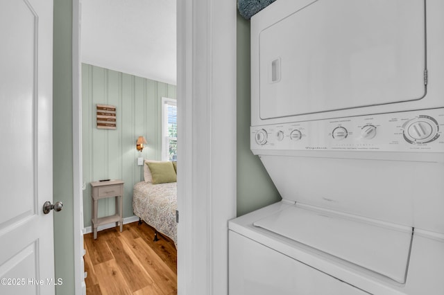1020 Carolina Beach Ave N, Carolina Beach, NC 28428 - laundry room featuring stacked washer / drying machine and light wood finished floors