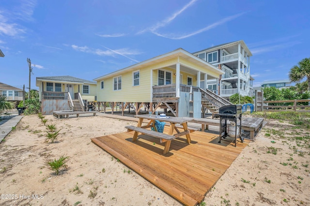 1020 Carolina Beach Ave N, Carolina Beach, NC 28428 - back of property featuring stairs and a wooden deck