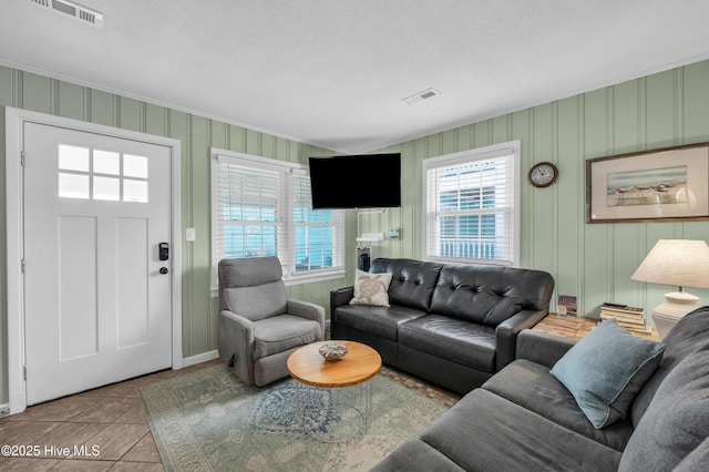 1020 Carolina Beach Ave N, Carolina Beach, NC 28428 - living room featuring tile patterned floors and crown molding