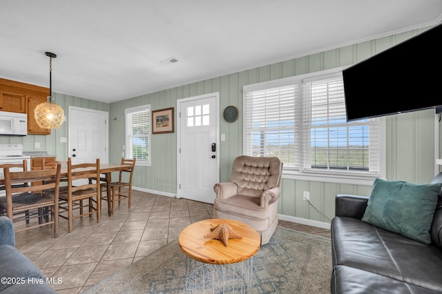 1020 Carolina Beach Ave N, Carolina Beach, NC 28428 - living area featuring light tile patterned floors and baseboards