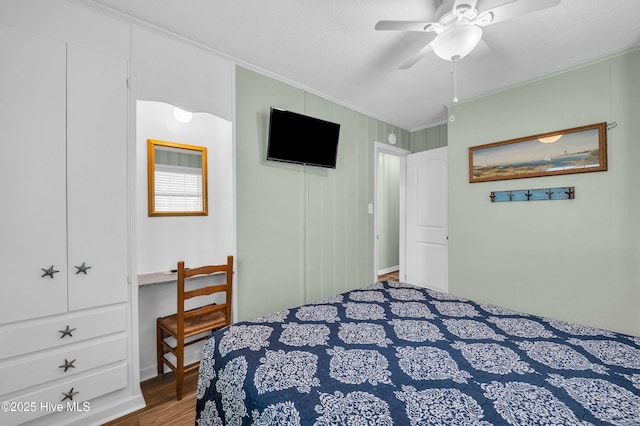 1020 Carolina Beach Ave N, Carolina Beach, NC 28428 - bedroom featuring ornamental molding, wood finished floors, and ceiling fan