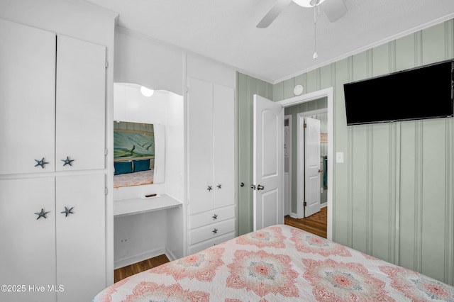 1020 Carolina Beach Ave N, Carolina Beach, NC 28428 - bedroom with wood finished floors, crown molding, and ceiling fan