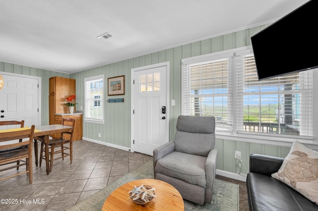 1020 Carolina Beach Ave N, Carolina Beach, NC 28428 - living area featuring tile patterned flooring and a textured ceiling