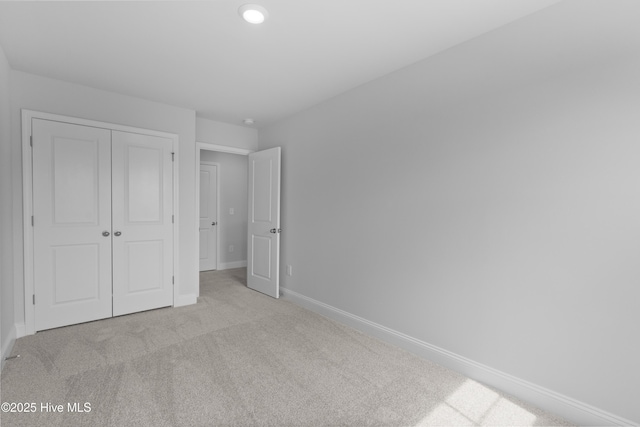 250 Arnette Dr Unit 83B, Ocean Isle Beach, NC 28469 - unfurnished bedroom with carpet, a closet, and baseboards