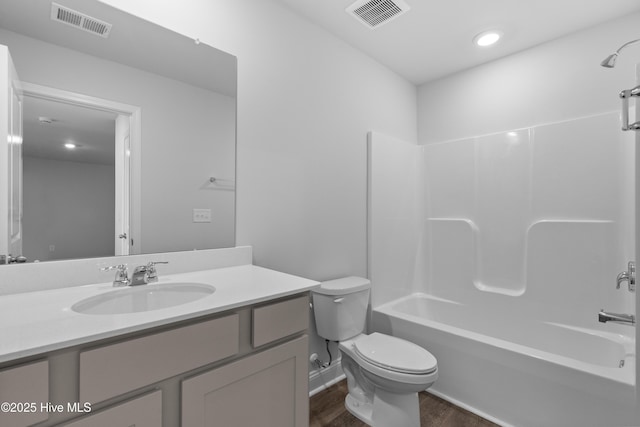 250 Arnette Dr Unit 83B, Ocean Isle Beach, NC 28469 - full bath with wood finished floors, toilet, vanity, bathtub / shower combination, and recessed lighting