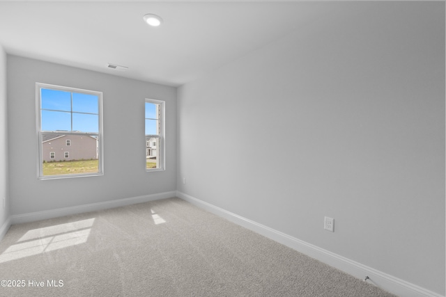 250 Arnette Dr Unit 83B, Ocean Isle Beach, NC 28469 - spare room with baseboards and carpet