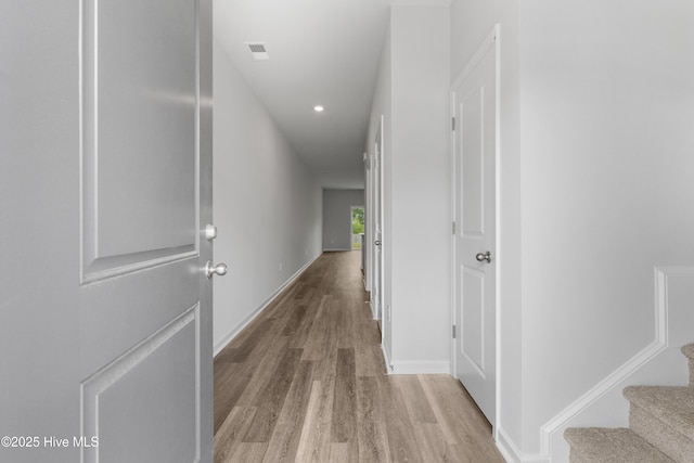 250 Arnette Dr Unit 83B, Ocean Isle Beach, NC 28469 - corridor with light wood finished floors, baseboards, recessed lighting, and stairs