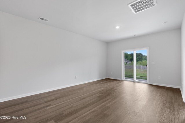 250 Arnette Dr Unit 83B, Ocean Isle Beach, NC 28469 - unfurnished room with dark wood-type flooring, baseboards, and recessed lighting