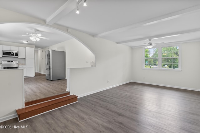 352 Brenda Dr, Wilmington, NC 28409 - unfurnished living room with ceiling fan, beamed ceiling, wood finished floors, and baseboards