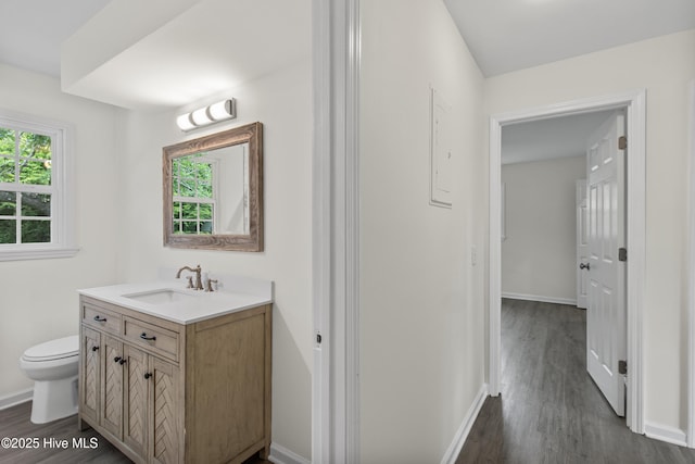 352 Brenda Dr, Wilmington, NC 28409 - bathroom featuring vanity, wood finished floors, toilet, and baseboards