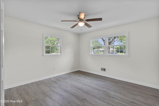 352 Brenda Dr, Wilmington, NC 28409 - empty room with dark wood-style floors, ceiling fan, and baseboards