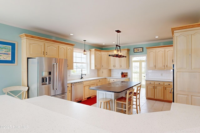 306 Marina Way N, Topsail Beach, NC 28460 - kitchen with appliances with stainless steel finishes, light brown cabinetry, backsplash, crown molding, and light tile patterned floors
