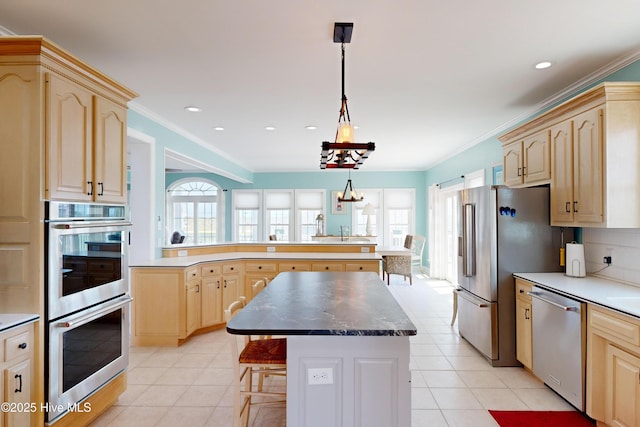 306 Marina Way N, Topsail Beach, NC 28460 - kitchen with appliances with stainless steel finishes, light brown cabinets, a peninsula, a center island, and crown molding
