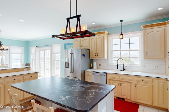 306 Marina Way N, Topsail Beach, NC 28460 - kitchen with stainless steel appliances, a sink, light brown cabinetry, backsplash, and ornamental molding