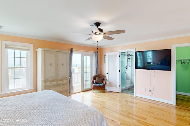 306 Marina Way N, Topsail Beach, NC 28460 - bedroom featuring light wood-style floors, ornamental molding, a walk in closet, access to outside, and baseboards