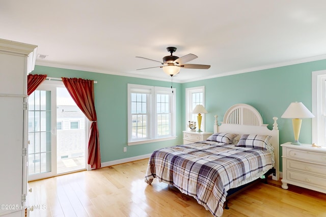 306 Marina Way N, Topsail Beach, NC 28460 - bedroom with light wood finished floors, access to exterior, ornamental molding, ceiling fan, and baseboards