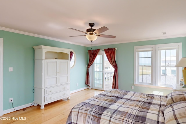 306 Marina Way N, Topsail Beach, NC 28460 - bedroom featuring light wood-style floors, baseboards, ornamental molding, and ceiling fan