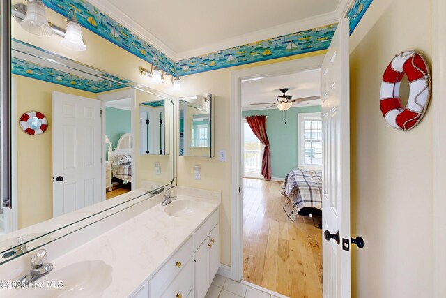 306 Marina Way N, Topsail Beach, NC 28460 - bathroom featuring ensuite bath, double vanity, baseboards, ceiling fan, and wood finished floors