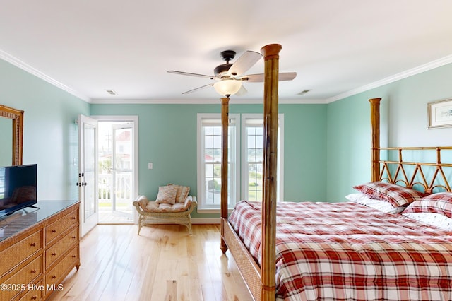 306 Marina Way N, Topsail Beach, NC 28460 - bedroom with access to outside, light wood-style flooring, crown molding, and ceiling fan