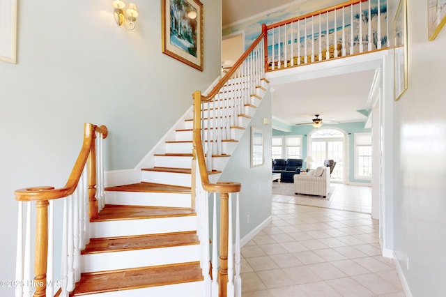306 Marina Way N, Topsail Beach, NC 28460 - stairway with baseboards, ceiling fan, tile patterned flooring, and ornamental molding