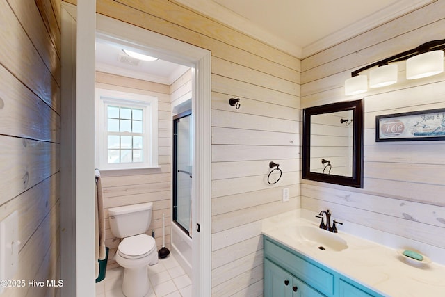 306 Marina Way N, Topsail Beach, NC 28460 - bathroom with wood walls, crown molding, vanity, toilet, and enclosed tub / shower combo