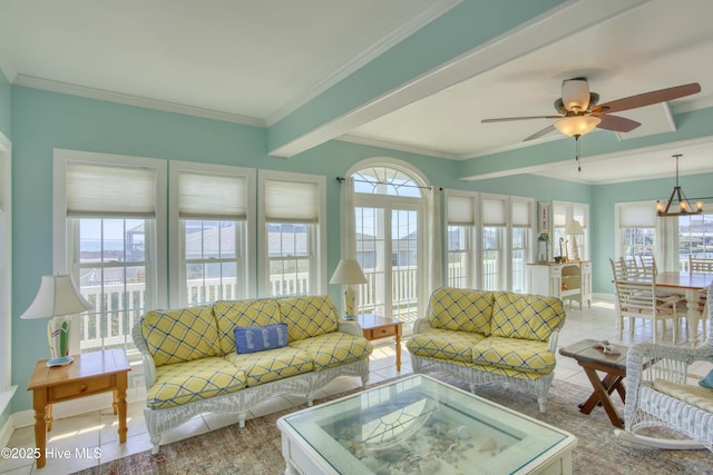 306 Marina Way N, Topsail Beach, NC 28460 - living room with baseboards, ceiling fan, tile patterned flooring, beamed ceiling, and crown molding