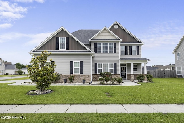 700 Stafford Ln, Jacksonville, NC 28546 - craftsman-style home with board and batten siding, stone siding, a porch, and central AC