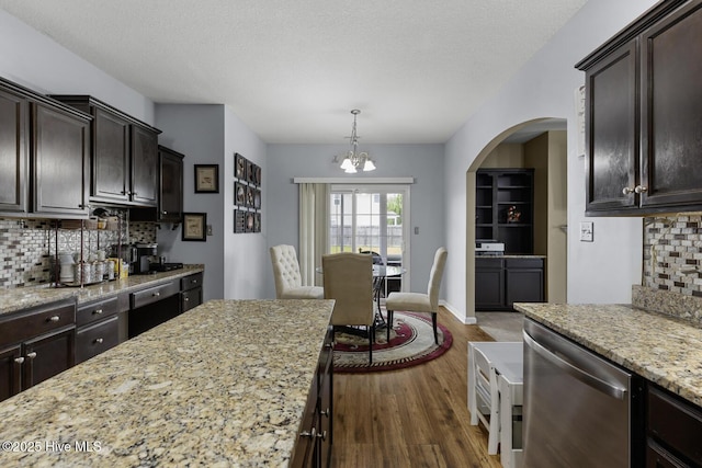 700 Stafford Ln, Jacksonville, NC 28546 - kitchen featuring dishwasher, a chandelier, dark wood-type flooring, and backsplash