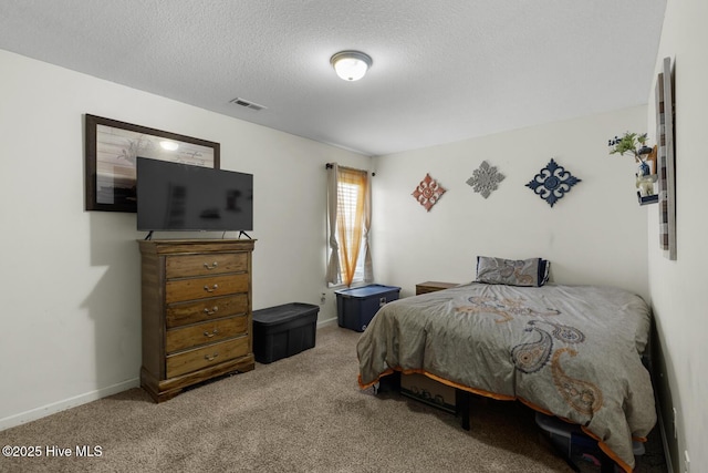 700 Stafford Ln, Jacksonville, NC 28546 - carpeted bedroom with a textured ceiling and baseboards
