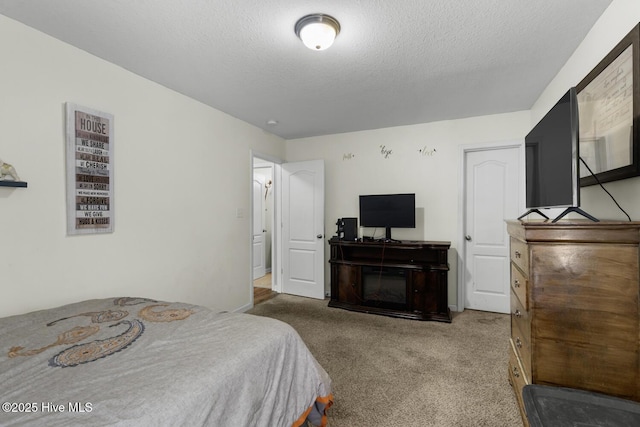 700 Stafford Ln, Jacksonville, NC 28546 - bedroom with a textured ceiling and carpet flooring