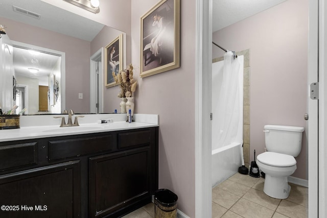 700 Stafford Ln, Jacksonville, NC 28546 - bathroom featuring vanity, tile patterned floors, toilet, and shower / bath combo with shower curtain