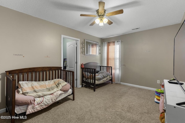 700 Stafford Ln, Jacksonville, NC 28546 - bedroom with carpet flooring, a textured ceiling, ceiling fan, and baseboards