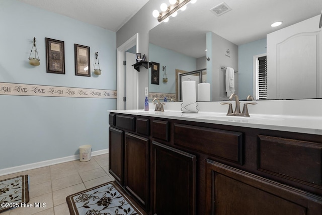 700 Stafford Ln, Jacksonville, NC 28546 - bathroom with double vanity, tile patterned flooring, and a stall shower