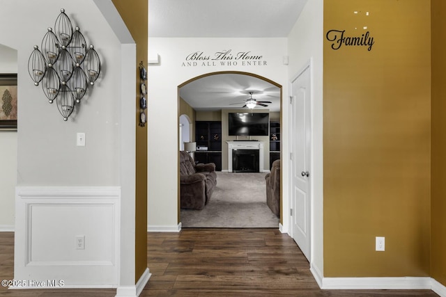 700 Stafford Ln, Jacksonville, NC 28546 - corridor featuring dark wood finished floors, arched walkways, and baseboards