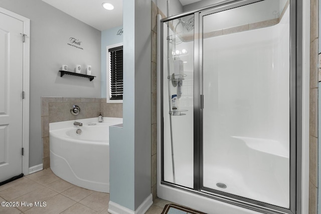 700 Stafford Ln, Jacksonville, NC 28546 - full bathroom with a bath, a shower stall, tile patterned flooring, and baseboards